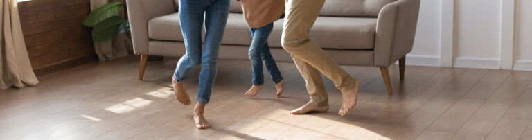 family dancing on vinyl plank hero - America's Carpet Barn